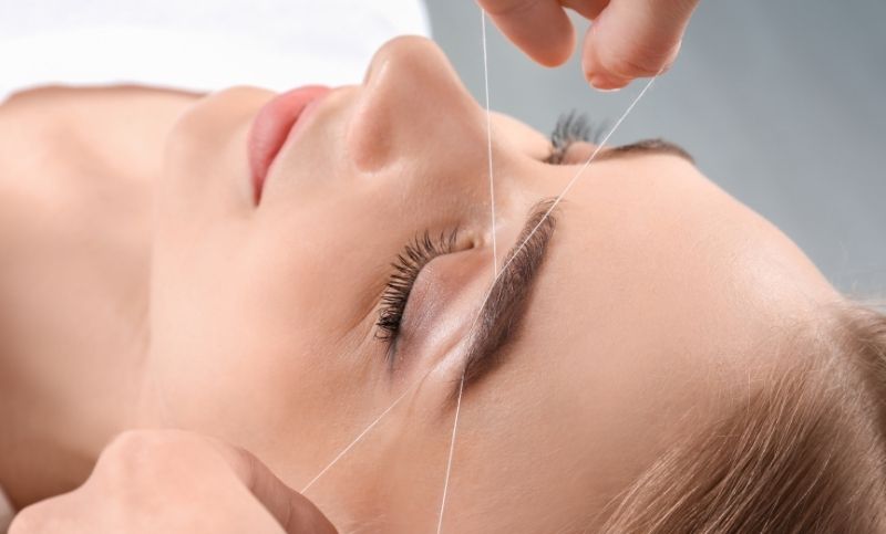 Close Up Of A Woman Getting An Eyebrow Threading